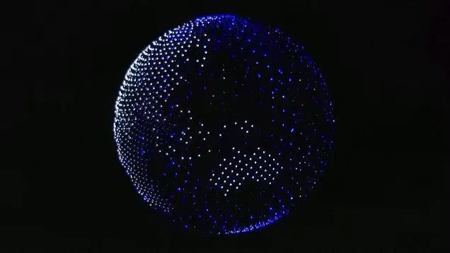 Illuminated sphere with blue and white lights