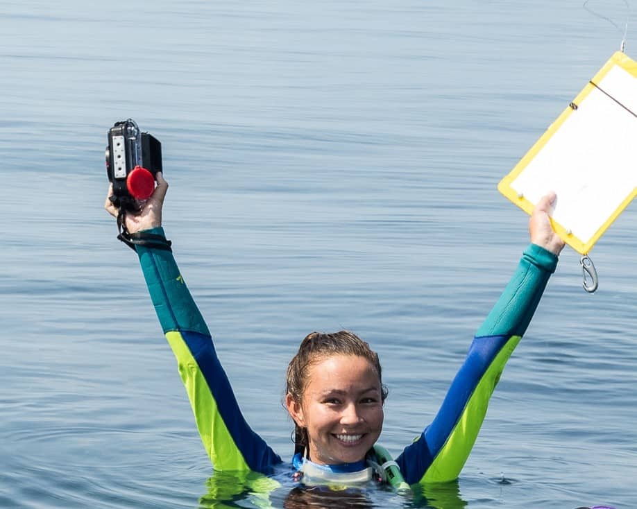 drones used for research Valeria Cornet, female researcher on the surface of the water smiling. Photograph by Grumpy Turtle Creative