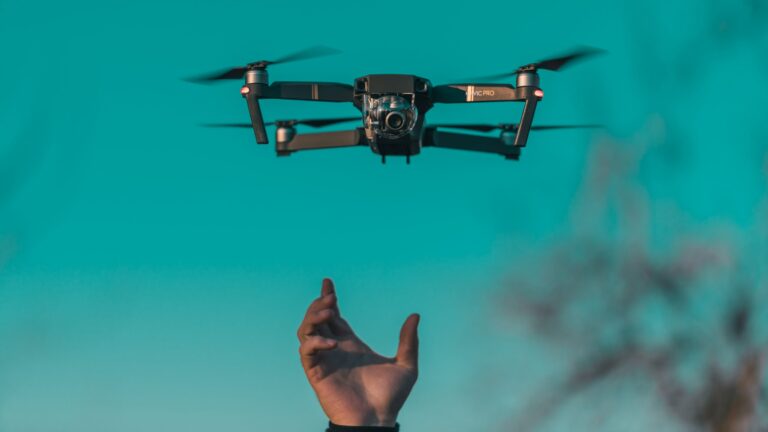 Drone hovering above a person's outstretched hand.
