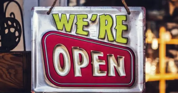 Bright sign indicating the store is open.