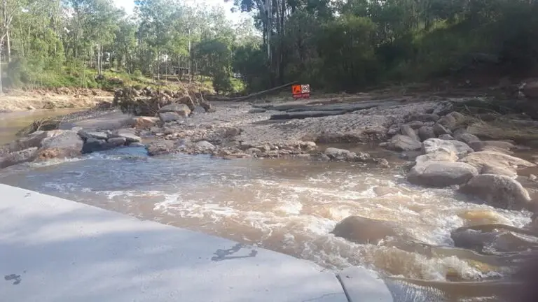 Rushing water over rocks in a natural setting.