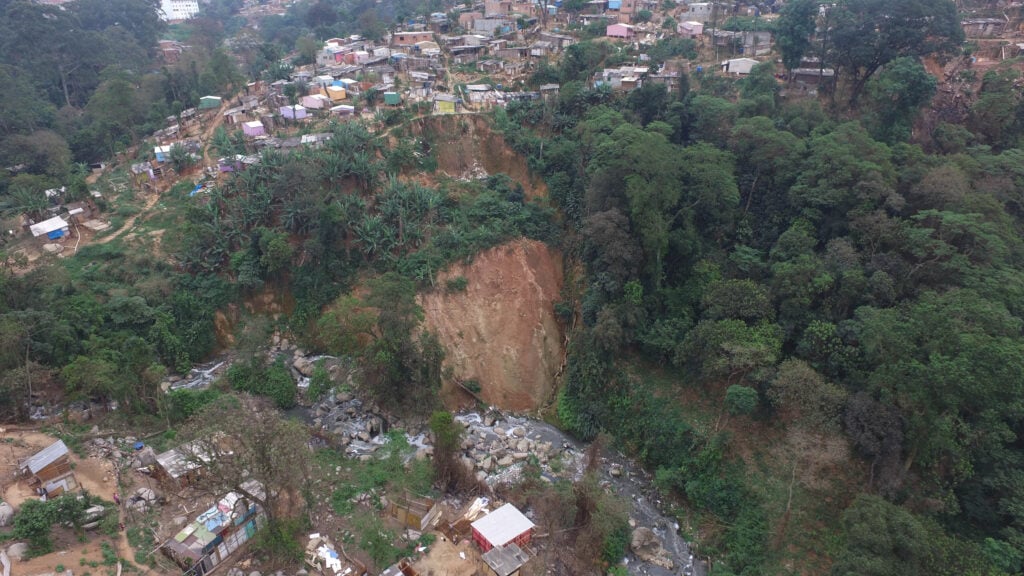 Aerial view of a landslide near housing area.