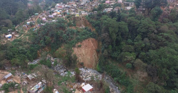 Aerial view of a landslide near housing area.