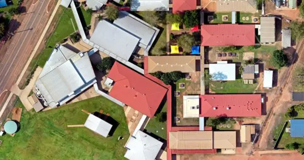 Aerial view of residential buildings and gardens.