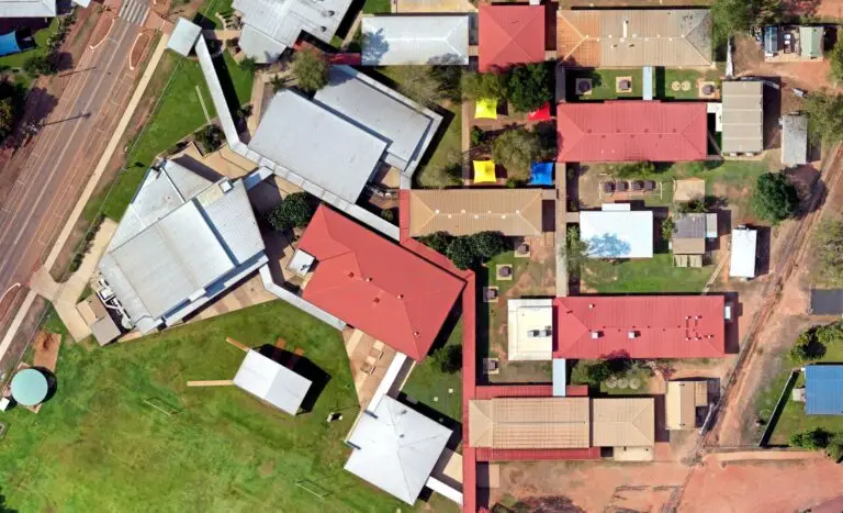 Aerial view of residential buildings and gardens.