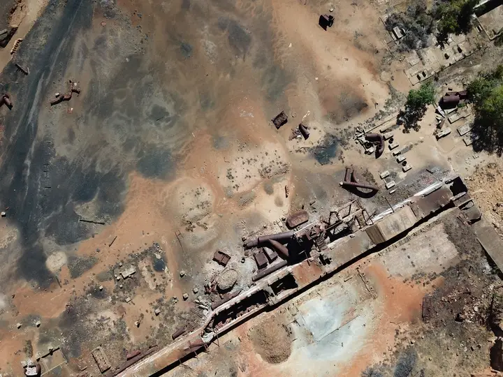 Aerial view of a weathered industrial site.