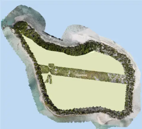 Aerial view of a tropical island landscape.