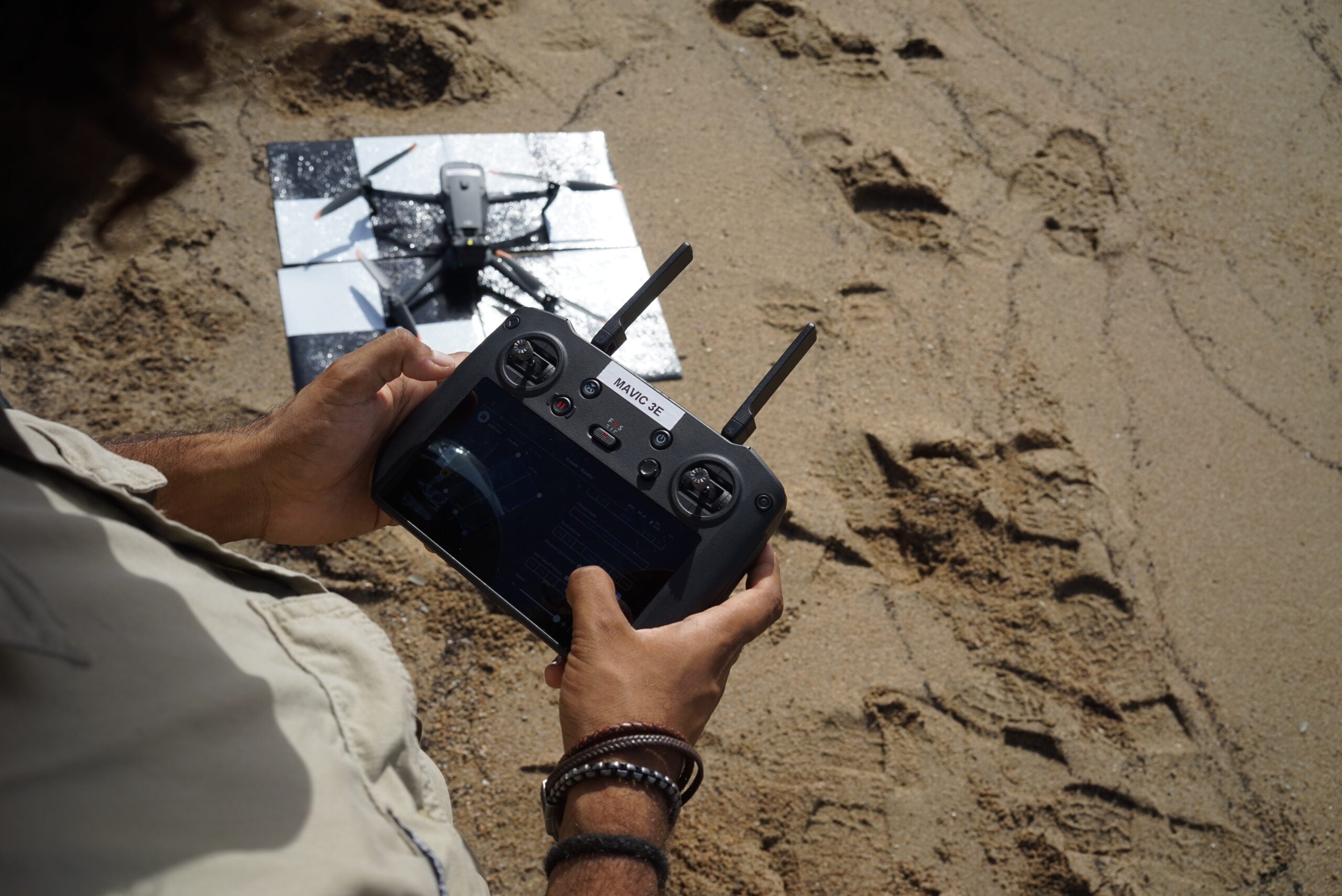 Drone with a remote controller planning a drone mapping mission