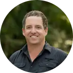 Smiling man outdoors in a circular frame