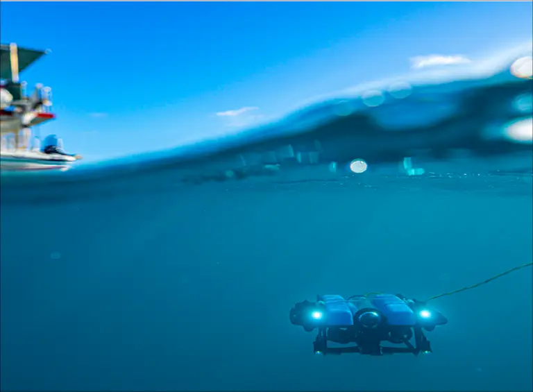 Underwater drone exploring the ocean surface.