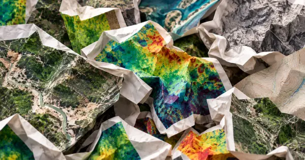 Crumpled aerial maps and colourful terrain prints